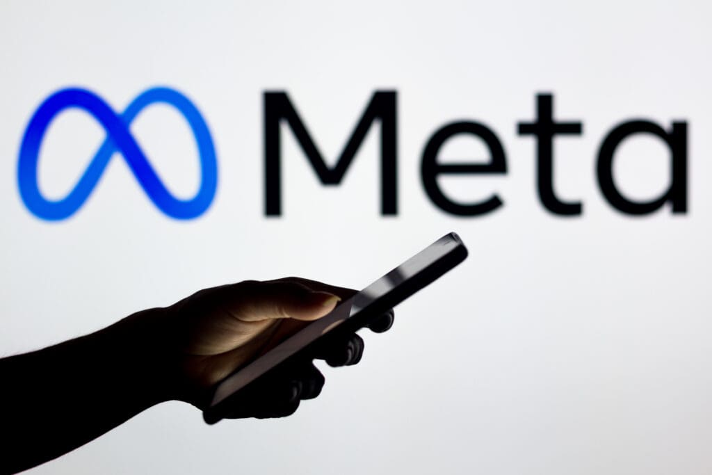 Why google ads and meta ads work better together for tradies 3 March 16 2022 brazil this photo illustration meta platforms logo seen background silhouette woman holding mobile phone