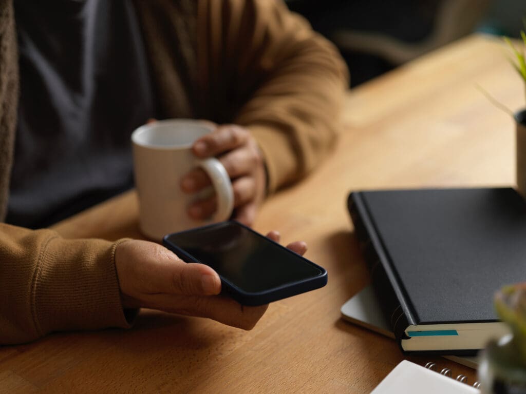 Why google ads and meta ads work better together for tradies 2 Midsection man holding coffee cup table
